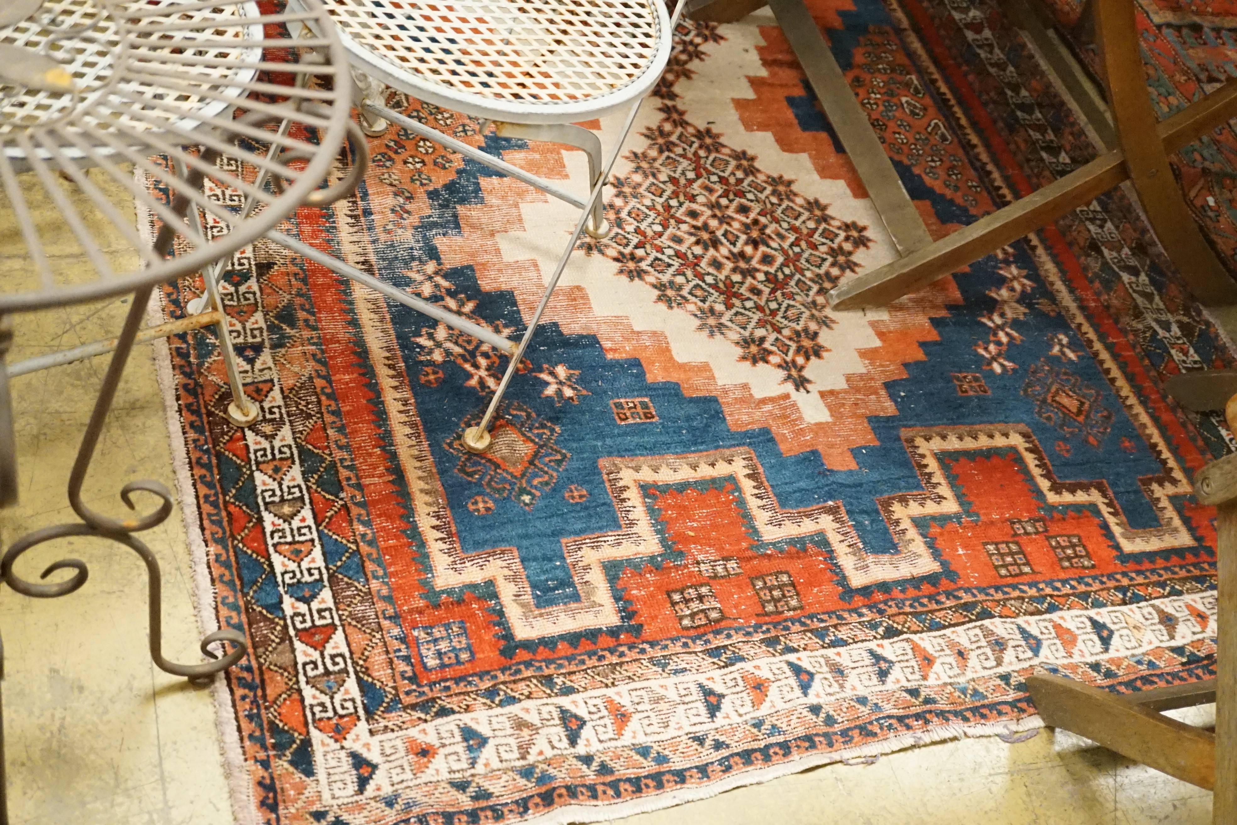 An antique Afshar ivory ground rug, 196 x 142cm